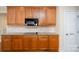 Kitchen features granite countertops and ample cabinetry at 8809 Landsdowne Ave, Harrisburg, NC 28075