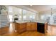 Kitchen with island, granite countertops, and hardwood floors at 8809 Landsdowne Ave, Harrisburg, NC 28075