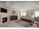 Main bedroom with fireplace and neutral decor at 8809 Landsdowne Ave, Harrisburg, NC 28075