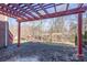 Brick patio with pergola and wooded views at 8809 Landsdowne Ave, Harrisburg, NC 28075