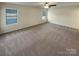 Bright bedroom with neutral walls and carpeted floors at 934 Pointe Andrews Dr, Concord, NC 28025