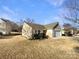 House exterior showcasing a well-maintained lawn and landscaping at 934 Pointe Andrews Dr, Concord, NC 28025