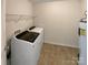 Laundry room with washer, dryer, and overhead shelving at 934 Pointe Andrews Dr, Concord, NC 28025