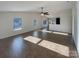 Spacious living room featuring hardwood floors and a high ceiling at 934 Pointe Andrews Dr, Concord, NC 28025