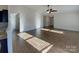 Bright living room with hardwood floors and a ceiling fan at 934 Pointe Andrews Dr, Concord, NC 28025