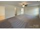 Spacious main bedroom with carpet and ensuite bathroom at 934 Pointe Andrews Dr, Concord, NC 28025