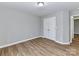 Neutral bedroom featuring closet with double doors and wood-look flooring is awaiting your personal touches at 1007 Astoria Dr, Monroe, NC 28110