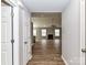 View of the open-concept living room featuring wood flooring and a fireplace at 1007 Astoria Dr, Monroe, NC 28110