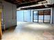 Large unfinished basement space with sliding glass door and ample square footage at 108 Vance Allen Ave, Rockwell, NC 28138