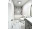 Updated bathroom with modern vanity, toilet and tub with tiled wall at 108 Vance Allen Ave, Rockwell, NC 28138