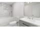 Modern bathroom with gray vanity, marble tile, and bathtub at 108 Vance Allen Ave, Rockwell, NC 28138