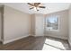 Well-lit bedroom with wood-look floors and ceiling fan at 108 Vance Allen Ave, Rockwell, NC 28138