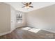 Simple bedroom with wood-look floors and a window with natural light at 108 Vance Allen Ave, Rockwell, NC 28138