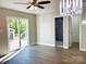 Bright bedroom boasts a ceiling fan, modern lighting, and sliding glass doors to a deck at 108 Vance Allen Ave, Rockwell, NC 28138