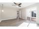 Bright bedroom with wood-look floors and sliding glass door to deck at 108 Vance Allen Ave, Rockwell, NC 28138