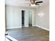 Bedroom features a ceiling fan, neutral paint, and luxury vinyl flooring at 108 Vance Allen Ave, Rockwell, NC 28138