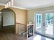 The entryway with the natural light boasts a brick wall, staircase, and access to outdoor deck at 108 Vance Allen Ave, Rockwell, NC 28138