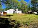 Stylish home with ample backyard space, a detached garage, and lush surrounding trees at 108 Vance Allen Ave, Rockwell, NC 28138