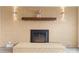 Modern electric fireplace with a wood mantel and brick surround at 108 Vance Allen Ave, Rockwell, NC 28138