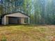 Detached garage offering ample space for parking, storage, or potential workshop use at 108 Vance Allen Ave, Rockwell, NC 28138
