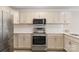 Modern kitchen with stainless steel appliances and white cabinets at 108 Vance Allen Ave, Rockwell, NC 28138