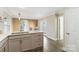 Open kitchen with island, stainless steel appliances, and white cabinets at 108 Vance Allen Ave, Rockwell, NC 28138