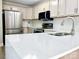 Updated kitchen with stainless steel appliances, modern countertops, and an open layout, ready for entertaining at 108 Vance Allen Ave, Rockwell, NC 28138