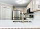An eat-in kitchen features stainless steel appliances, a large sink, and an open layout with updated countertops at 108 Vance Allen Ave, Rockwell, NC 28138
