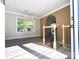 Open living space with archway, large window, and modern light fixture at 108 Vance Allen Ave, Rockwell, NC 28138