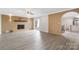 Open living room with a brick fireplace, hardwood floors, and access to deck at 108 Vance Allen Ave, Rockwell, NC 28138