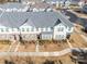 Aerial view of townhouses with gray roofs and attached garages at 1412 Galloway Rd, Charlotte, NC 28262