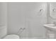 Clean bathroom with toilet, sink, and mirror at 1412 Galloway Rd, Charlotte, NC 28262
