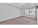 Spacious bedroom with two windows and carpet at 1412 Galloway Rd, Charlotte, NC 28262