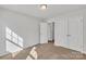 Bright bedroom with carpet flooring and double door closet at 1412 Galloway Rd, Charlotte, NC 28262