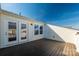 Spacious deck with doors leading to an upper level bedroom at 1412 Galloway Rd, Charlotte, NC 28262