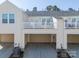 Rear view of three-car garage with covered parking and AC units at 1412 Galloway Rd, Charlotte, NC 28262