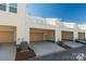Rear view of three-car garage with covered parking and AC units at 1412 Galloway Rd, Charlotte, NC 28262