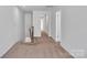 Upstairs hallway with carpet and access to bedrooms at 1412 Galloway Rd, Charlotte, NC 28262