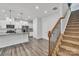 Open concept kitchen with island and staircase view at 1412 Galloway Rd, Charlotte, NC 28262