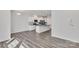 Modern kitchen with white cabinets and breakfast bar at 1412 Galloway Rd, Charlotte, NC 28262
