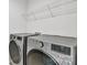 Laundry room with LG washer and dryer, and overhead shelving at 1412 Galloway Rd, Charlotte, NC 28262