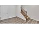 Interior staircase with metal railing and hardwood floors at 1412 Galloway Rd, Charlotte, NC 28262