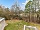 Expansive backyard view from the deck, showcasing lush greenery and mature trees at 14407 Brick Church Ct, Charlotte, NC 28277