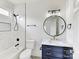 Chic bathroom with tub/shower combo, marble tile and gold hardware accents at 14407 Brick Church Ct, Charlotte, NC 28277