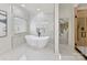 Modern bathroom features a soaking tub and a walk-in shower with marble tile at 14407 Brick Church Ct, Charlotte, NC 28277