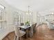 Dining room features windows with blinds and a view into the kitchen at 14407 Brick Church Ct, Charlotte, NC 28277