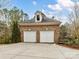 Detached two car garage with carriage doors and brick exterior at 14407 Brick Church Ct, Charlotte, NC 28277