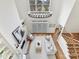 Open-concept living room with fireplace, large windows, and access to the staircase at 14407 Brick Church Ct, Charlotte, NC 28277
