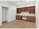 Bright office space with beautiful custom built-in shelving and hardwood floors at 14407 Brick Church Ct, Charlotte, NC 28277