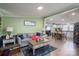 Open-concept living area flows into the dining space, with natural light and modern decor at 1762 Tomes Rd, Lincolnton, NC 28092